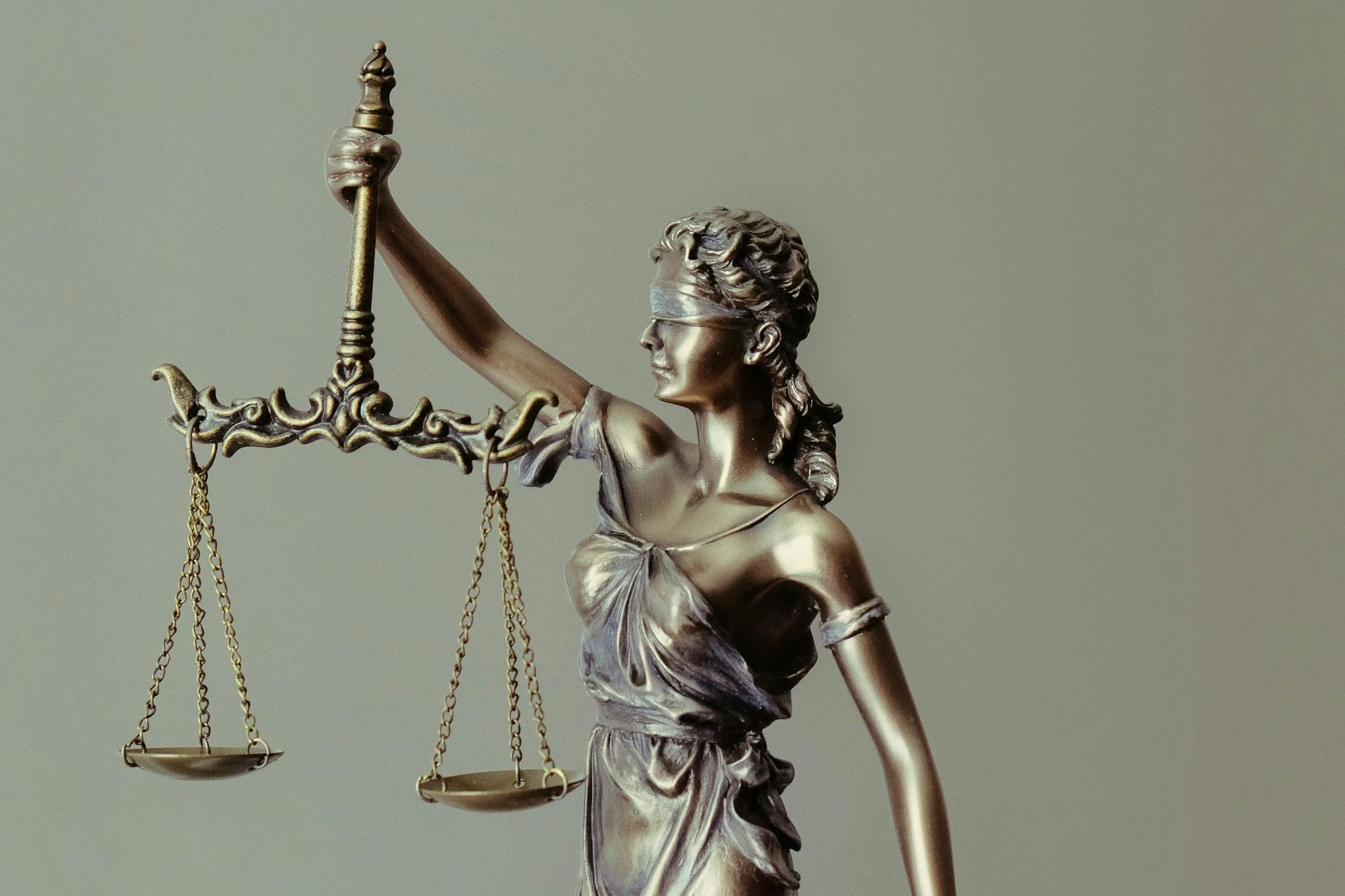 A statue of Lady Justice holding the scales of justice.